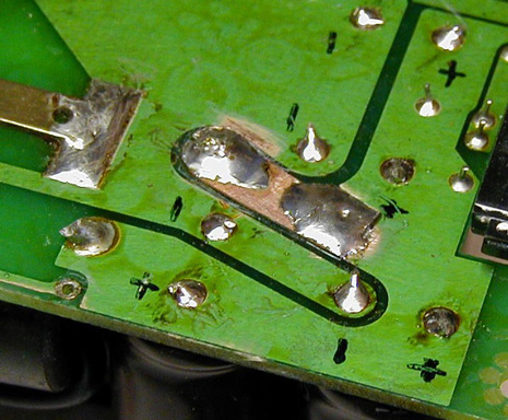 Fig.3: Close-up view of repaired L7 land trace. Click for larger image. Copyright 2004, K8AC.